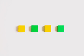 Four Colorful Wooden Blocks in a Straight Line