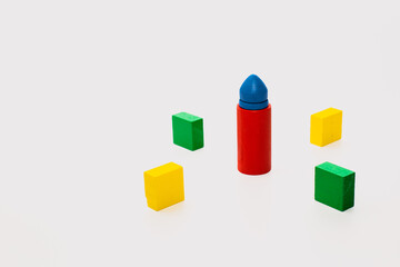 Colorful Wooden Toy Blocks and Cylinder on White Background