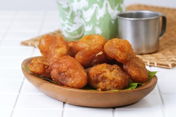 Indonesian sweet fried cassava snack Getuk Goreng on banana leaf, popular traditional delicacy from Java.