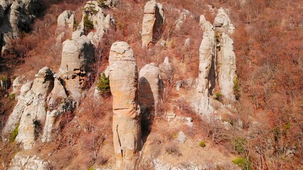 Unique rock formations on a mountain slope in autumn. Media