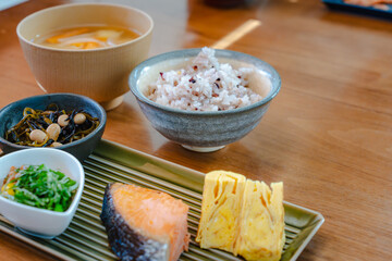 Traditional Japanese breakfast with grilled salmon and miso soup

