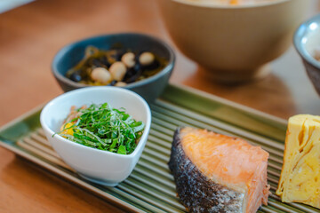 Traditional Japanese breakfast with grilled salmon and miso soup
