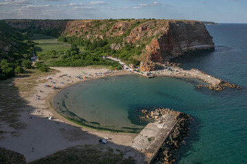 Wild sea beach under a bright sunny sky
