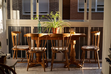A beautiful light entering the living room illuminates antique furniture.