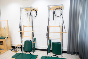 Background and banner. Pilates exercise machine at gym. Wooden pilates machine. Wooden Fitness...