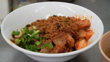 The fried kwetiau meatball at Bakso Bintang Asia Bandung is similar to Pho, a Vietnamese specialty dish served with coriander, basil, cayenne pepper, and lime, served in a white bowl