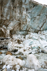 Shkhara Glacier Terminus In The Caucasus Mountains Near Ushguli Georgia: Dramatic View Of Ice Wall, Moraine And Rocky Foreground