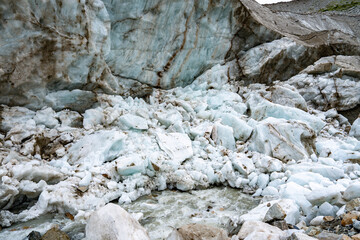 Shkhara Glacier Terminus In The Caucasus Mountains Near Ushguli Georgia: Dramatic View Of Ice Wall, Moraine And Rocky Foreground