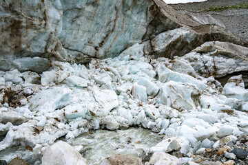 Shkhara Glacier Terminus In The Caucasus Mountains Near Ushguli Georgia: Dramatic View Of Ice Wall, Moraine And Rocky Foreground