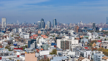 Naklejka premium Aerial landscape of Manhattan skyline from Williamsburg Bedstuy Brooklyn in New York City NY
