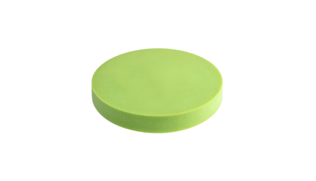 A single, light green, circular object against a stark black background