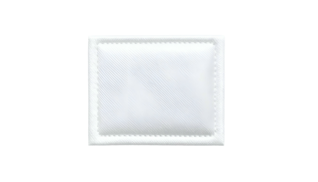 Isolated, close-up of a white, square facial pad, slightly textured, with a stitched border