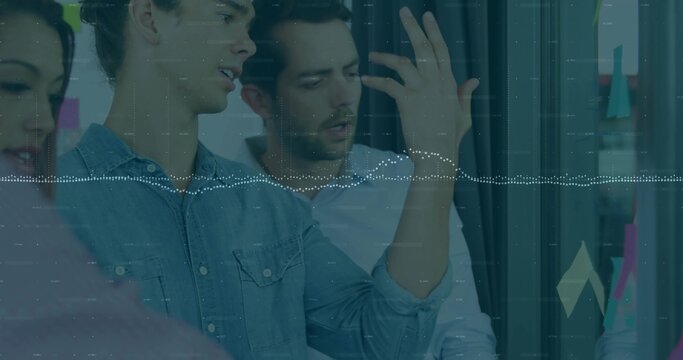 Gesturing denim shirt man presenting data in office, with whiteboard sticky notes and graph overlay - Powered by Adobe