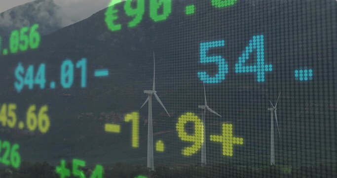 Three wind turbines standing at foothills, with LED ticker showing prices and currency symbols