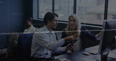 Pointing office team holding smartphone and analyzing data on desk monitor, with data overlay