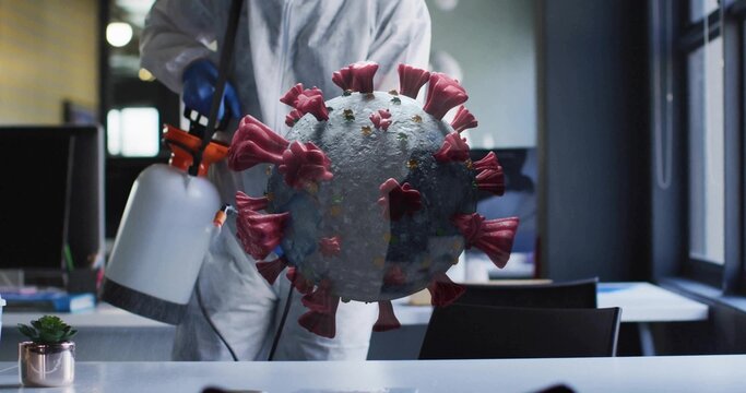 Spraying technician in suit and gloves targeting 3D virus model in office with disinfectant sprayer - Powered by Adobe