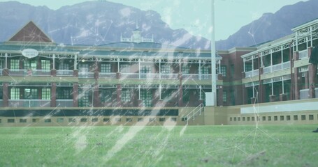 Capturing brick building featuring covered verandas on green lawn, with network code overlays