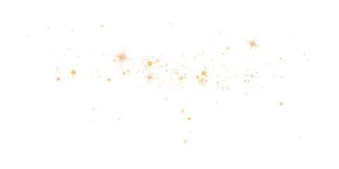 Gold sparks and stars glitter with a special light effect. Sparkles on a transparent background. Christmas abstract.