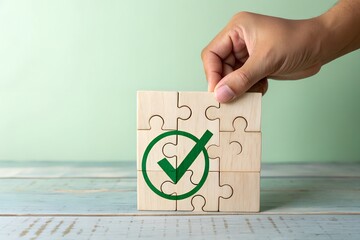 Hand placing final puzzle piece with green checkmark symbolizing completion and success