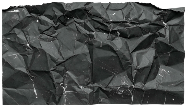 Close-up of a heavily crumpled, dark gray, rectangular paper with white speckles