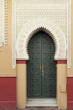 Seville, Spain, Europe. Beautiful grand entry door featuring Moorish architecture. 