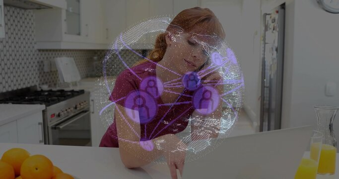 Typing woman handling teleconference call at kitchen island, with laptop smartphone overlay - Powered by Adobe