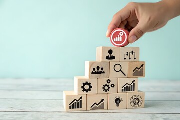 Hand placing final block on staircase of business growth and strategy icons