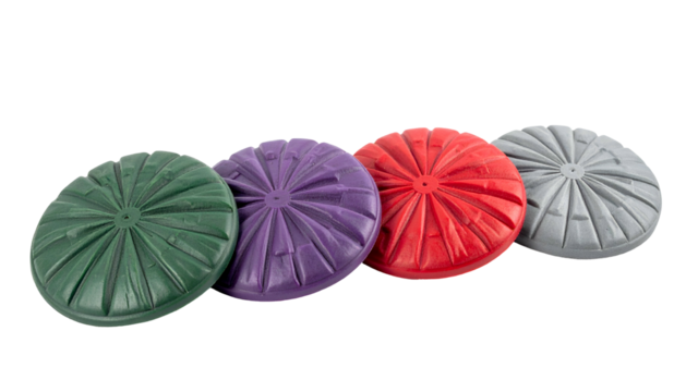 Four colorful, textured, round objects arranged diagonally on a black backdrop