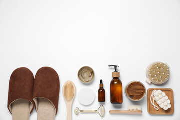 Flat lay composition with spa essentials on white background. Space for text
