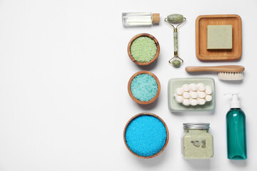Flat lay composition with spa essentials on white background. Space for text