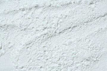Texture of dry talcum powder as background, top view