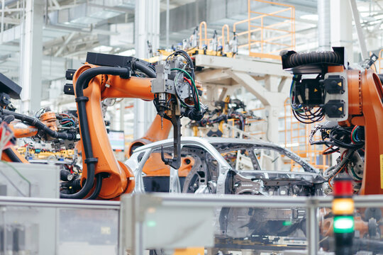 Automotive production line. Robotic Welding car body. Modern car Assembly plant