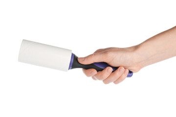 Woman with lint roller on white background, closeup