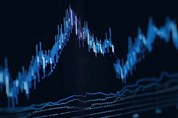 Naklejka premium Close-up of a graph chart showing financial data in shades of blue on a dark background