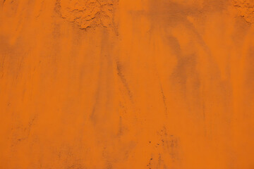 Obraz premium Textured orange surface with subtle dark speckles and variations