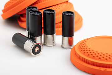 Black shotgun shell and clay pigeon target on white background , Gun shooting game