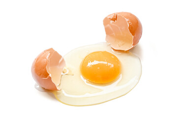 single broken egg with yolk isolated