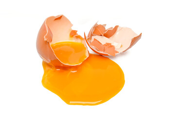 single broken egg with yolk isolated