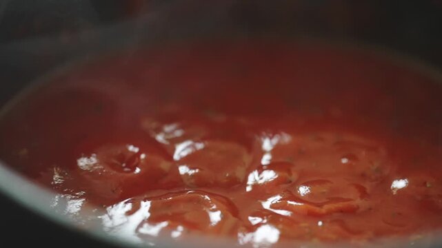 Close-up of Marinara Sauce Bubbling on Stove.