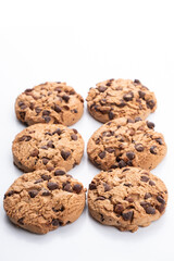 group of vertical cookies with chocolate chips on a white background
