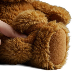 Ultra close-up of a plump brown teddy bear, paw pressed into body revealing velvety-soft plush, detailed fur, isolated on transparent background, comfort and warmth concept