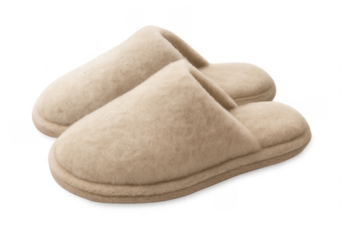 Pair of cozy beige fuzzy home slippers