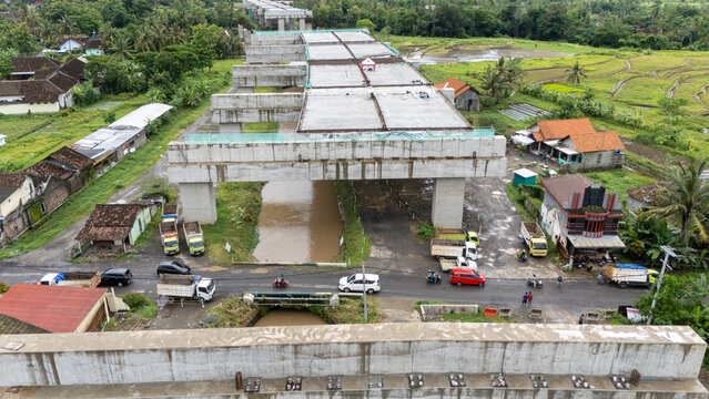 Bawen, Central Java: Greenery surrounds elevated toll road segments at a construction site