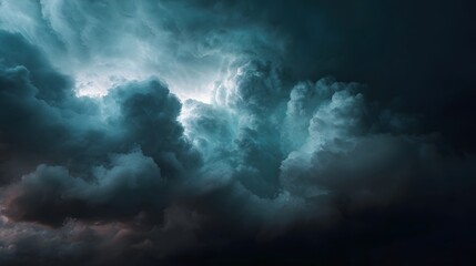 Fototapeta premium Dramatic storm clouds gather with intense light breaking through the turbulent dark mass creating an ominous atmosphere