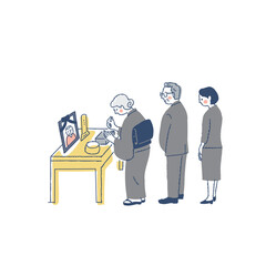 お葬式で焼香台に立つ喪服の参列者