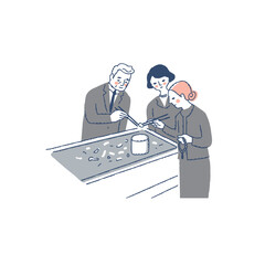 火葬後に骨上げをしている遺族