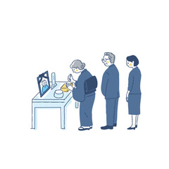 お葬式で焼香台に立つ喪服の参列者