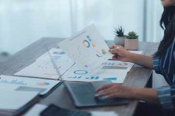 Businesswoman Analyzing Financial Data Charts