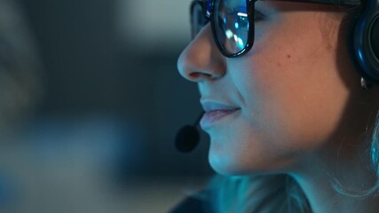 A close up of a smiling female customer service agent or call center employee wearing a headset. Online support, technical assistance, and professional digital communication during a night shift - Powered by Adobe