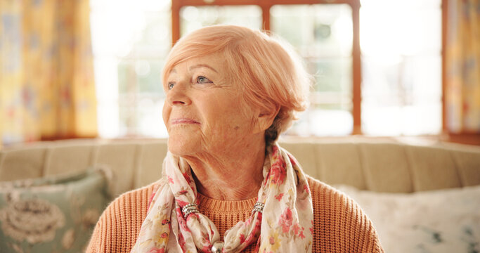 Happy, thinking and senior woman in home with hope, nostalgia and memory with vision. Smile, reflection and elderly person with inspiration, decision and remember in retirement in living room
